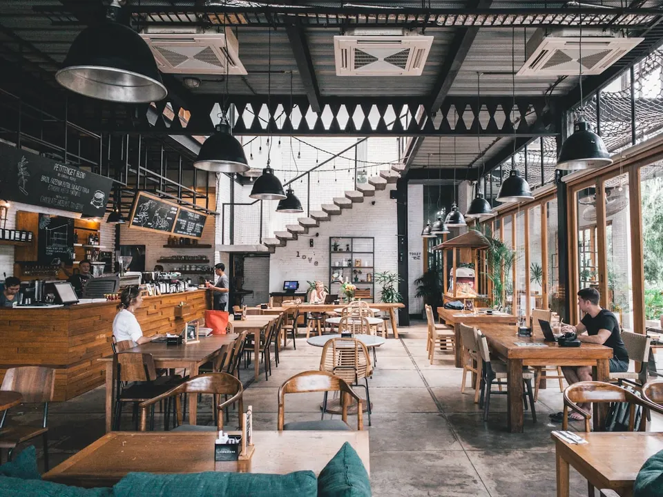 Warm, full dining room of a neighborhood restaurant